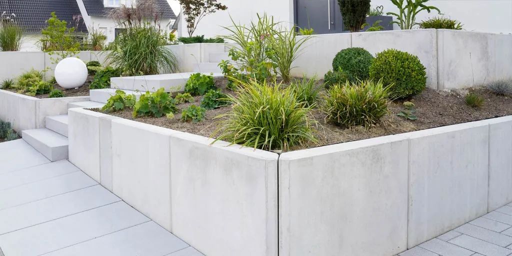 Concrete retaining walls with planters